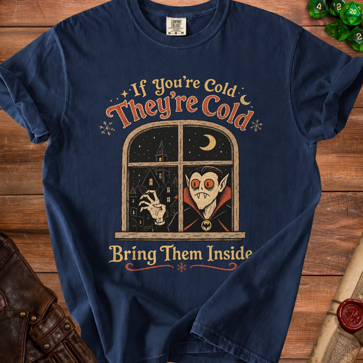Navy t-shirt with vampire at window graphic and text "If You're Cold, They're Cold. Bring Them Inside."