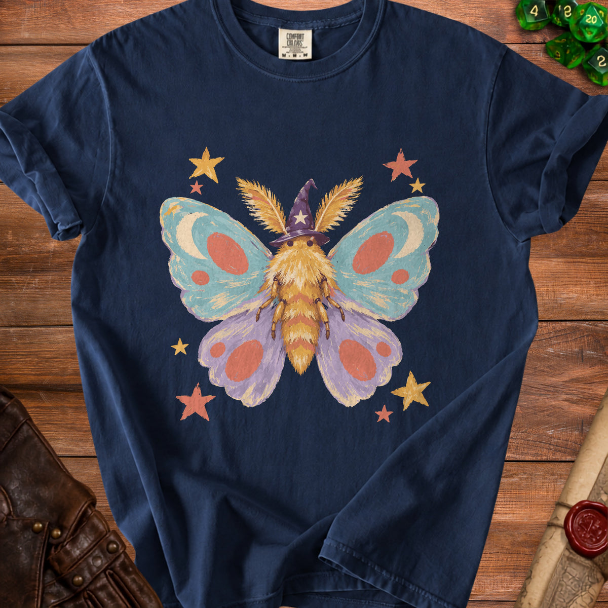 Navy t-shirt with a fuzzy moth wearing a witch hat and stars graphic.