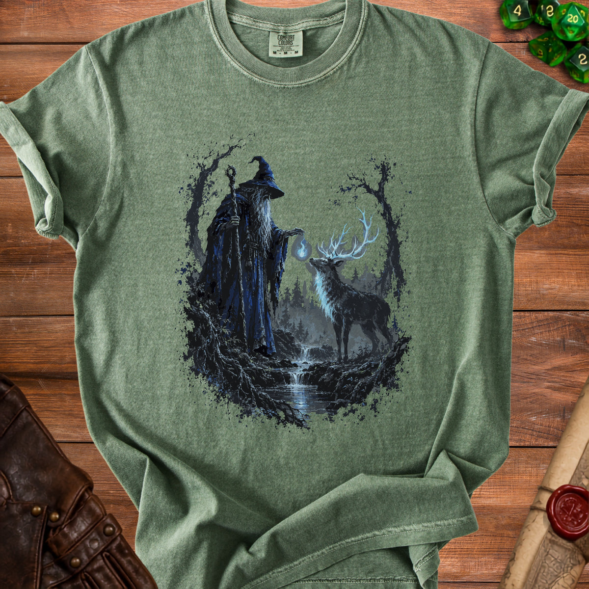 Green t-shirt with wizard and deer in mystical forest print.