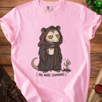 Pink t-shirt with a drawing of a hooded possum holding coffee and text "NO MORE SUMMONS".