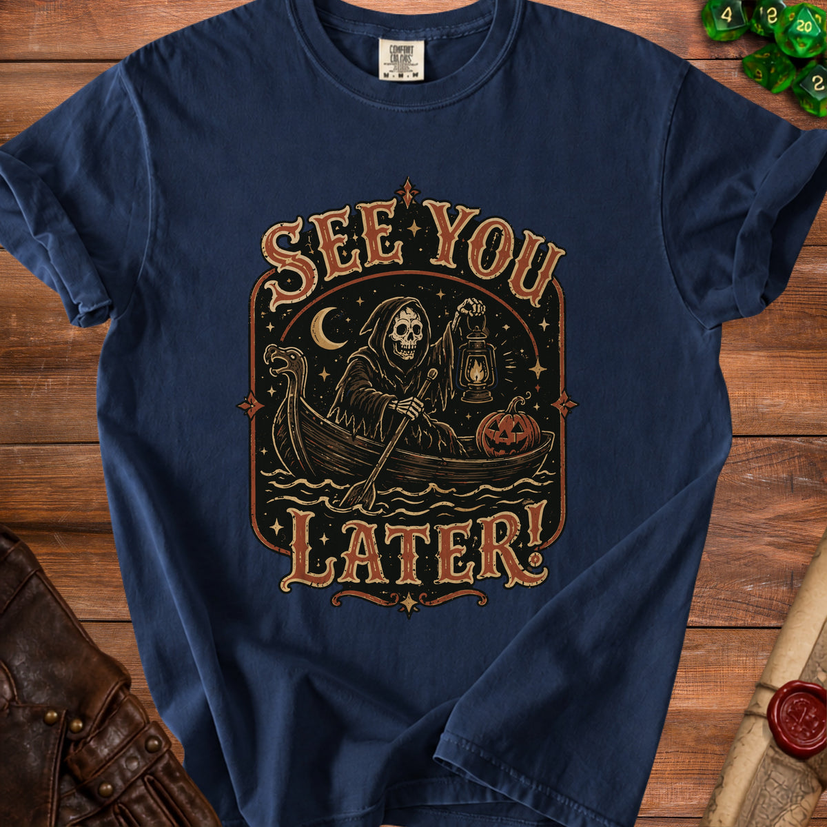 Navy t-shirt with Grim Reaper rowing a boat, saying "See You Later!".