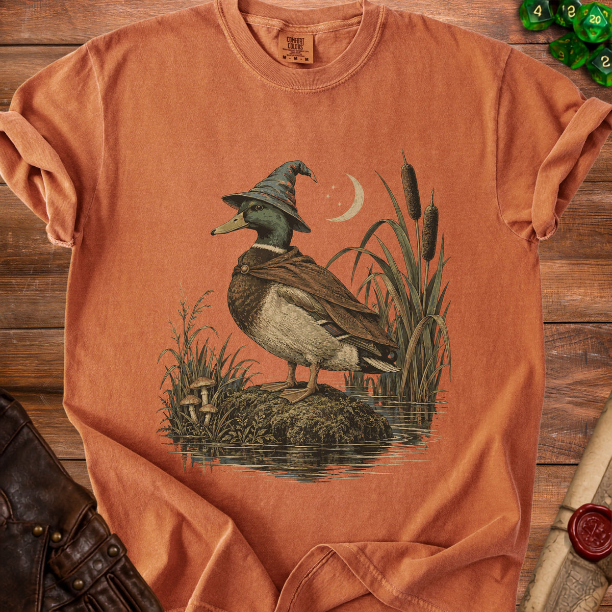 Mallard duck wearing wizard hat and cloak by moonlit water with reeds.