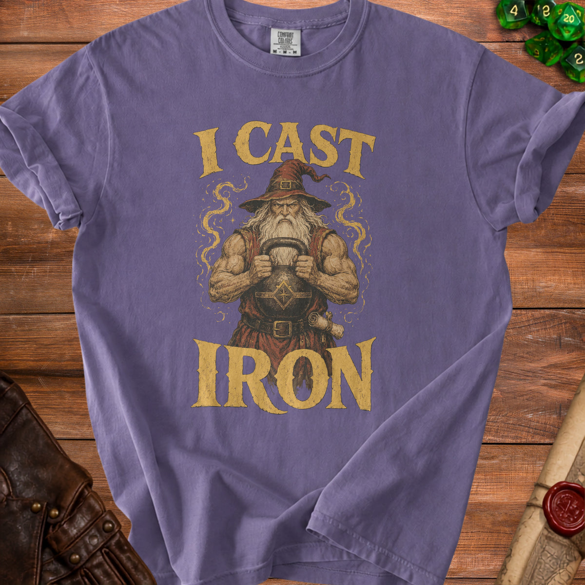 Purple t-shirt with "I CAST IRON" text and wizard holding kettlebell graphic.
