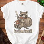 White t-shirt with illustration of a raccoon knight holding a sword and shield.