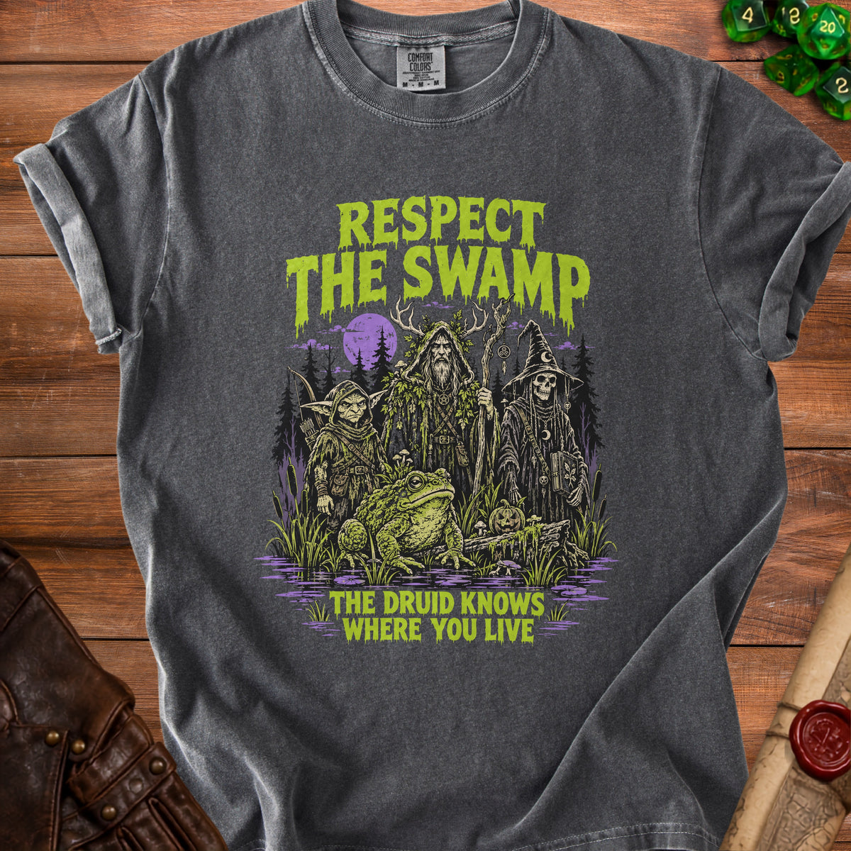 Dark t-shirt with "Respect The Swamp" and druids, a frog, and a skeleton.