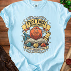 Light blue t-shirt graphic with "Plot Twist Department" and "Expect Complications."