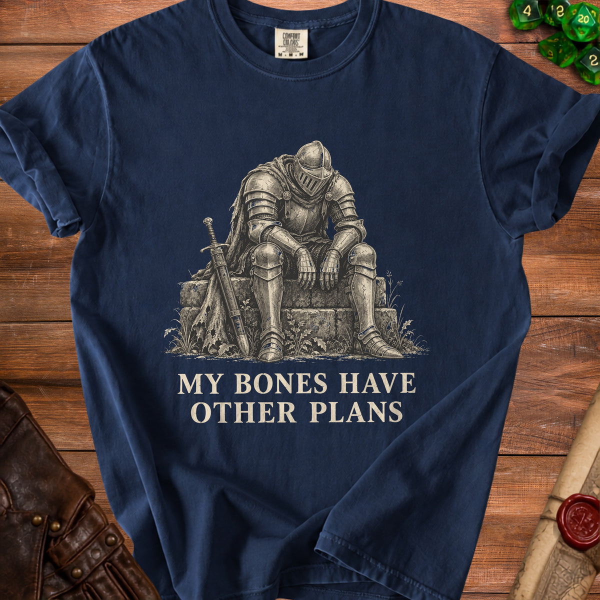 T-shirt with a knight sitting with sword and text "MY BONES HAVE OTHER PLANS".