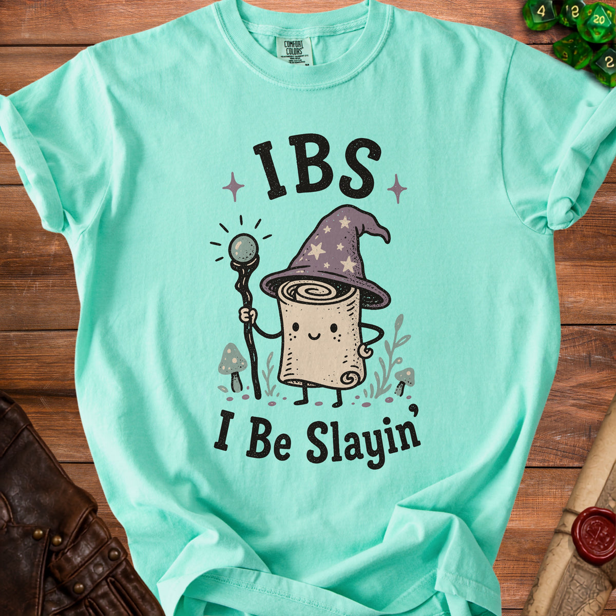 Mint green t-shirt with a scroll wizard graphic and text "IBS I Be Slayin".