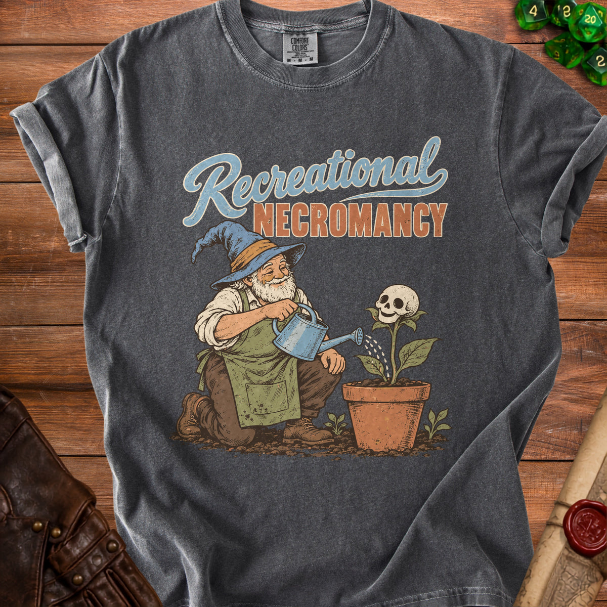 T-shirt graphic of wizard watering a skull-shaped plant with text "Recreational Necromancy."
