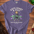 Purple t-shirt with "Let's Start A Cult Recruiting Bad Influences Since 1692" text and cartoon goblins.