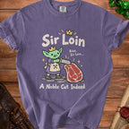 Purple t-shirt with goblin holding a sword to a steak, text "Sir Loin".