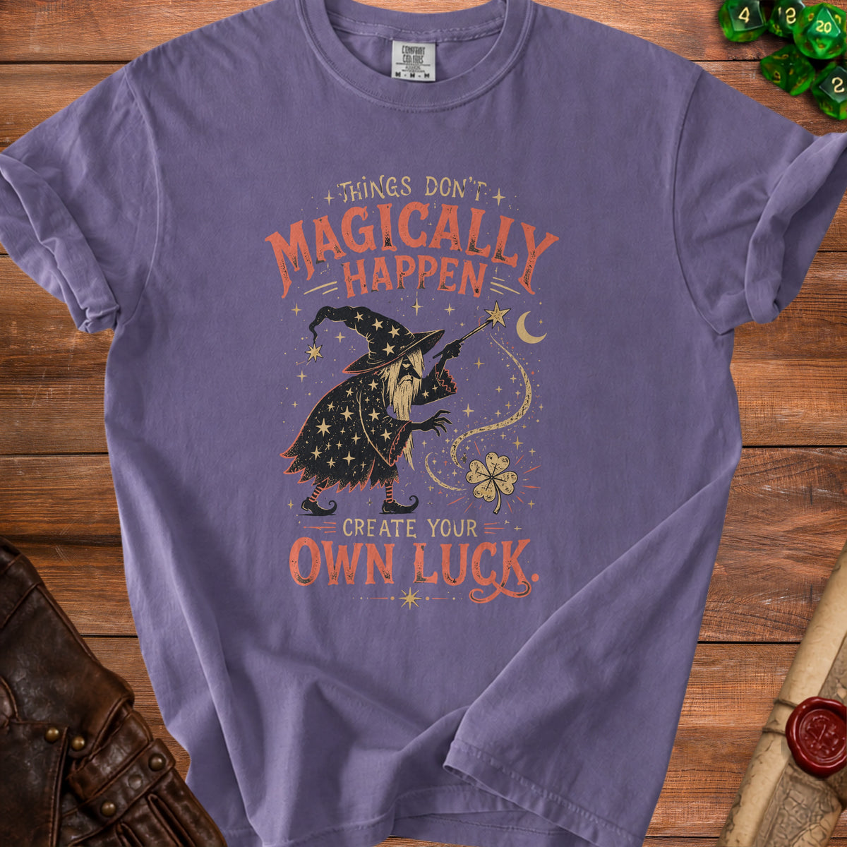 Purple t-shirt with a wizard graphic and text "Things Don't Magically Happen. Create Your Own Luck."