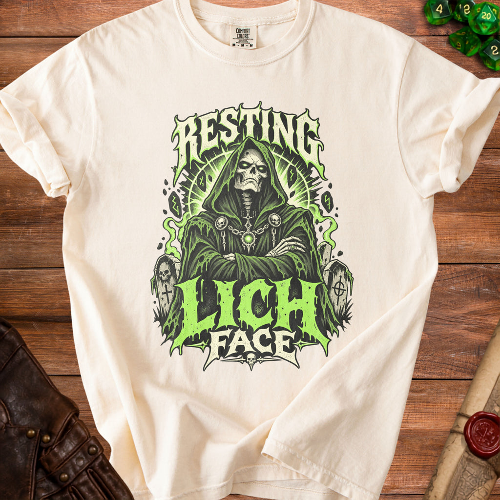Cream t-shirt with a green grim reaper graphic and "RESTING LICH FACE" text.