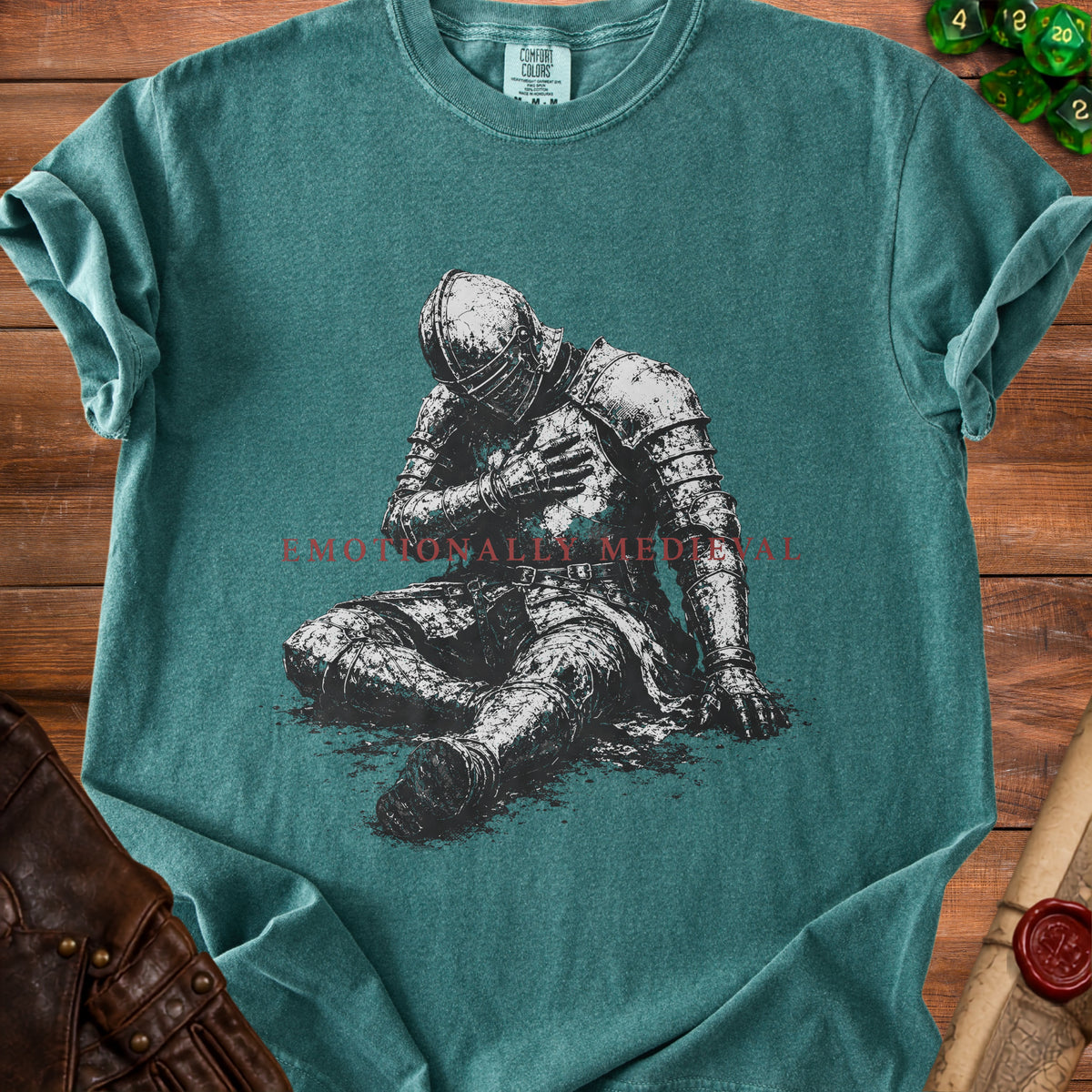 Green t-shirt with illustration of knight and text "Emotionally Medieval".
