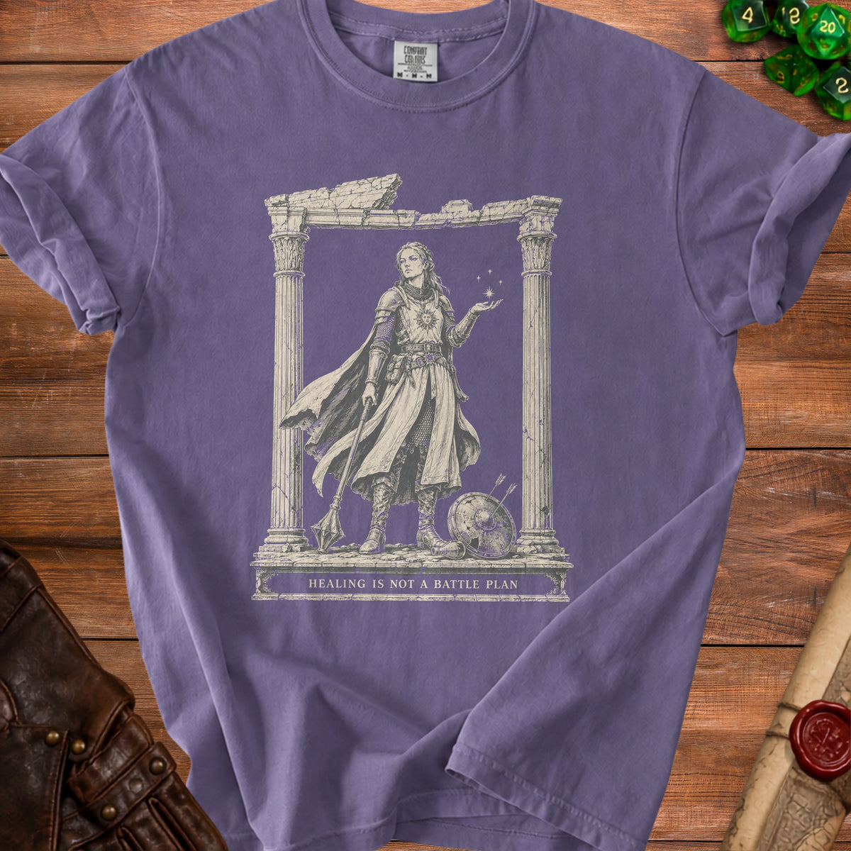 Purple t-shirt with illustration of a warrior woman and text "HEALING IS NOT A BATTLE PLAN".