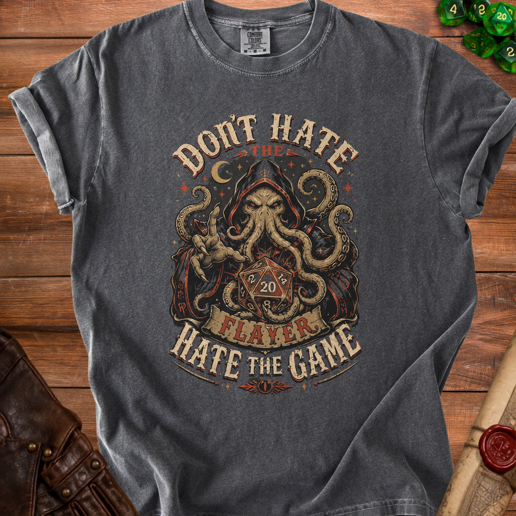 Dark t-shirt with a hooded octopus holding a twenty-sided die.