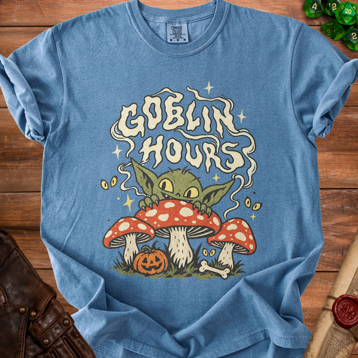 Blue t-shirt with "Goblin Hours" text and goblin character on mushrooms.
