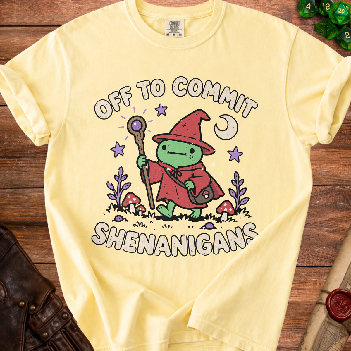 Yellow t-shirt with "Off to Commit Shenanigans" text and a wizard frog graphic.