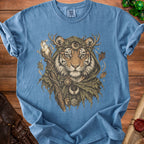 Blue t-shirt with print of a tiger wearing antlers, cloak, and holding a staff with crystal.
