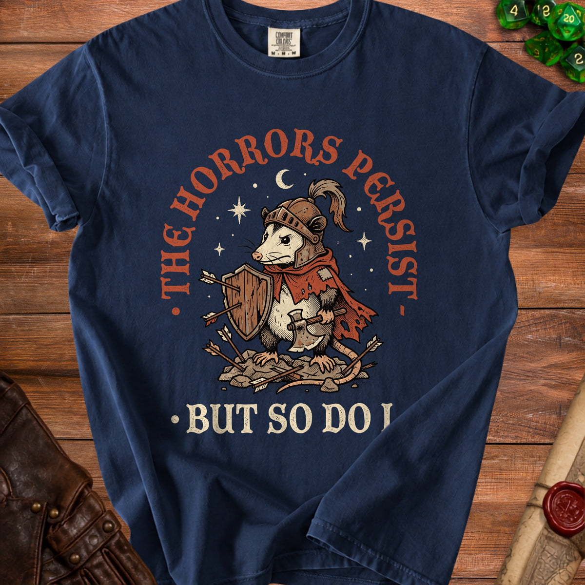 Navy t-shirt with a graphic of a knightly opossum holding an axe and shield.