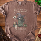 Brown t-shirt with wizard cat illustration and the text "I never think twice about my decisions. 37 times, yes, but never twice."