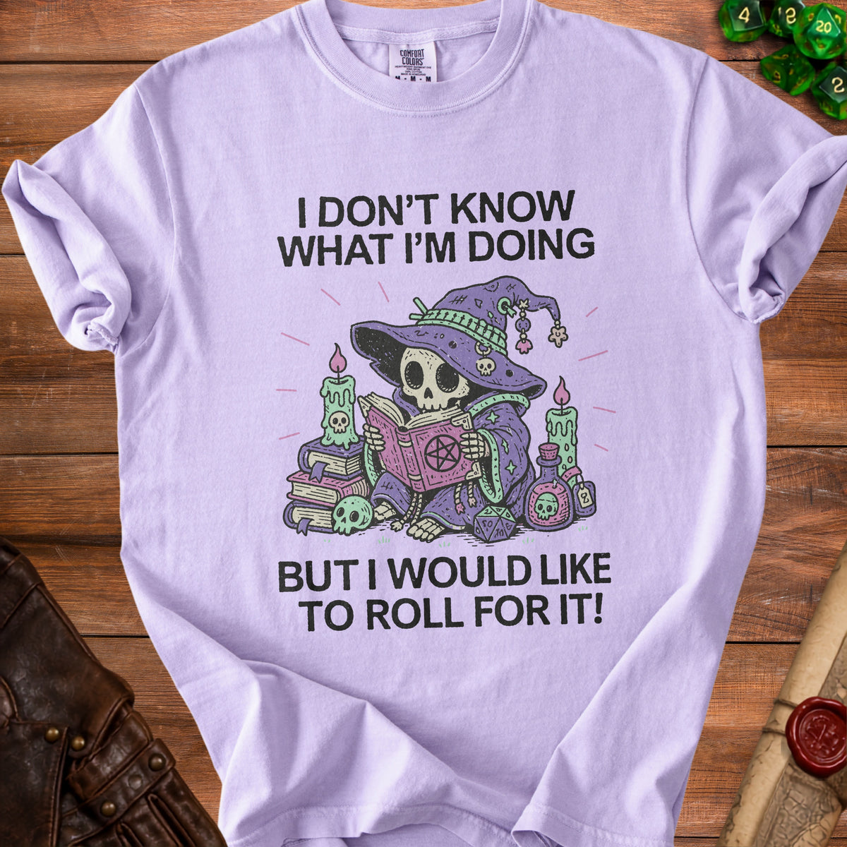 Purple t-shirt with skeleton witch and text: "I DON'T KNOW WHAT I'M DOING BUT I WOULD LIKE TO ROLL FOR IT!"