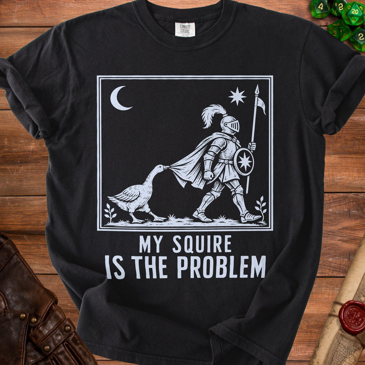 Black t-shirt with "MY SQUIRE IS THE PROBLEM" and a knight being pulled by a goose.