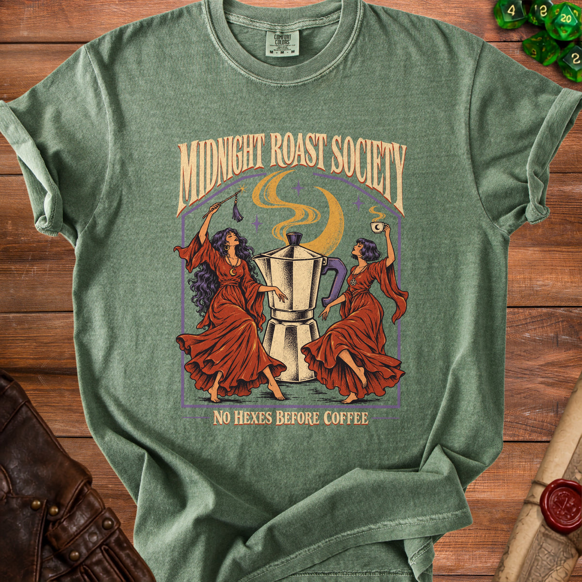 Green t-shirt with "Midnight Roast Society" and witches with coffee.