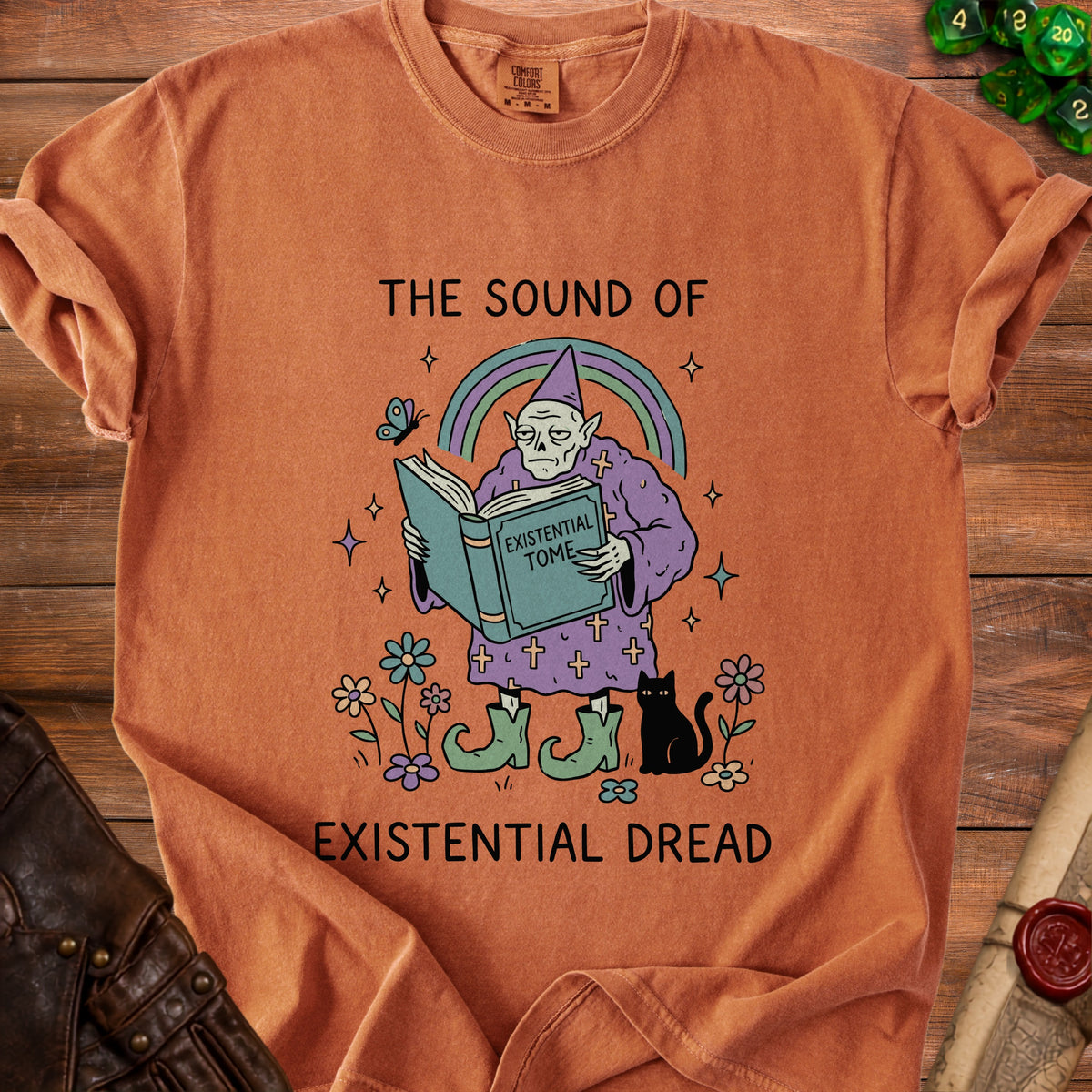 T-shirt graphic with a wizard reading an "Existential Tome" and text "The Sound of Existential Dread".