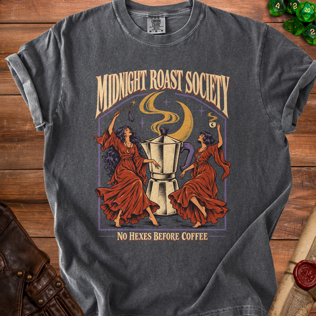 T-shirt with "Midnight Roast Society" and "No Hexes Before Coffee" text, featuring witches and coffee pot.