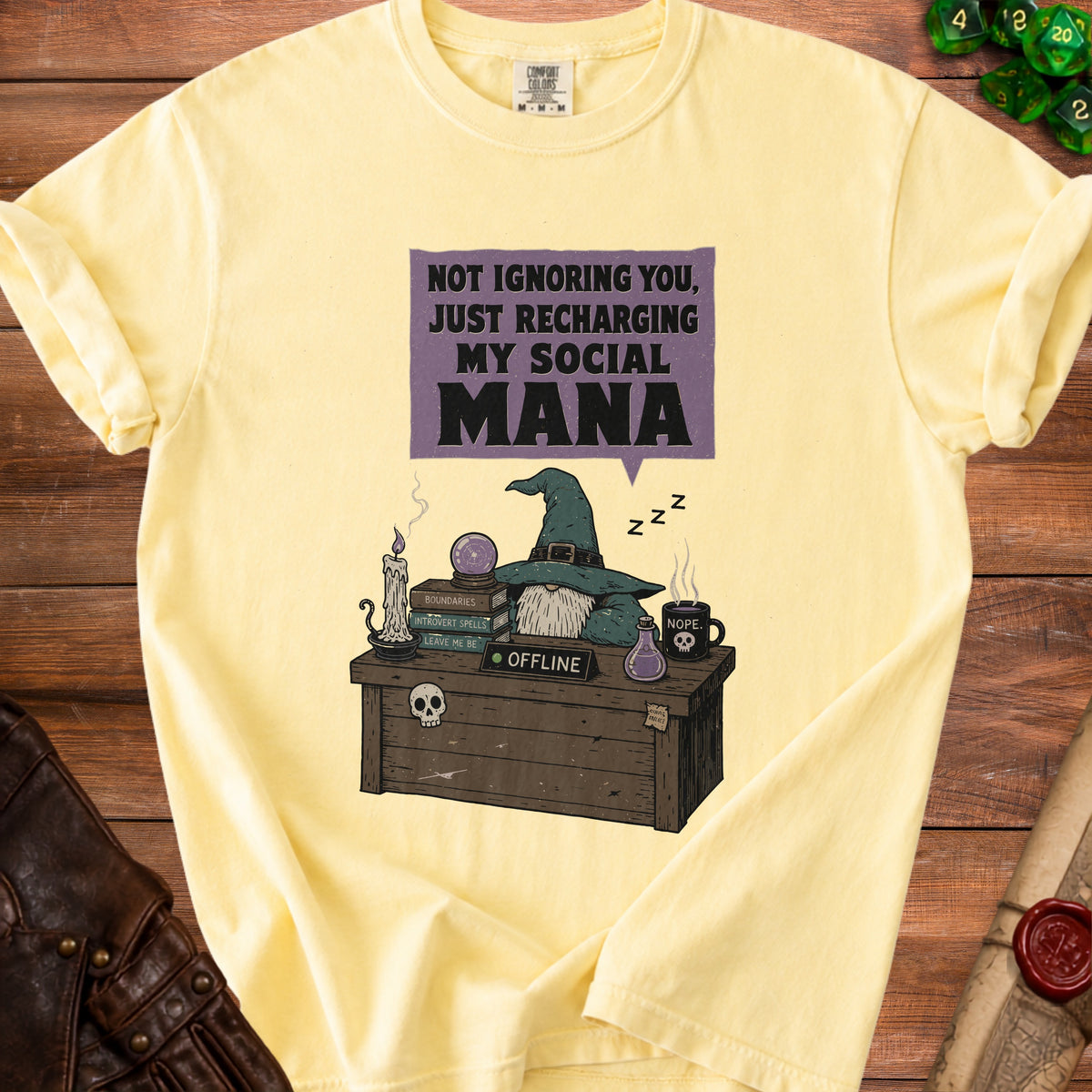 Yellow t-shirt with graphic of a gnome resting and text "Not Ignoring You, Just Recharging My Social Mana".