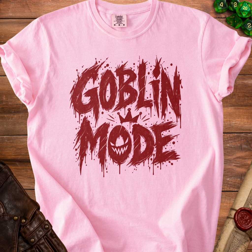 Pink t-shirt with red "Goblin Mode" text and a crowned goblin face graphic.