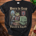 Black t-shirt with "Born to Leap Forced to Log Or" text and knight toad at computer graphic.