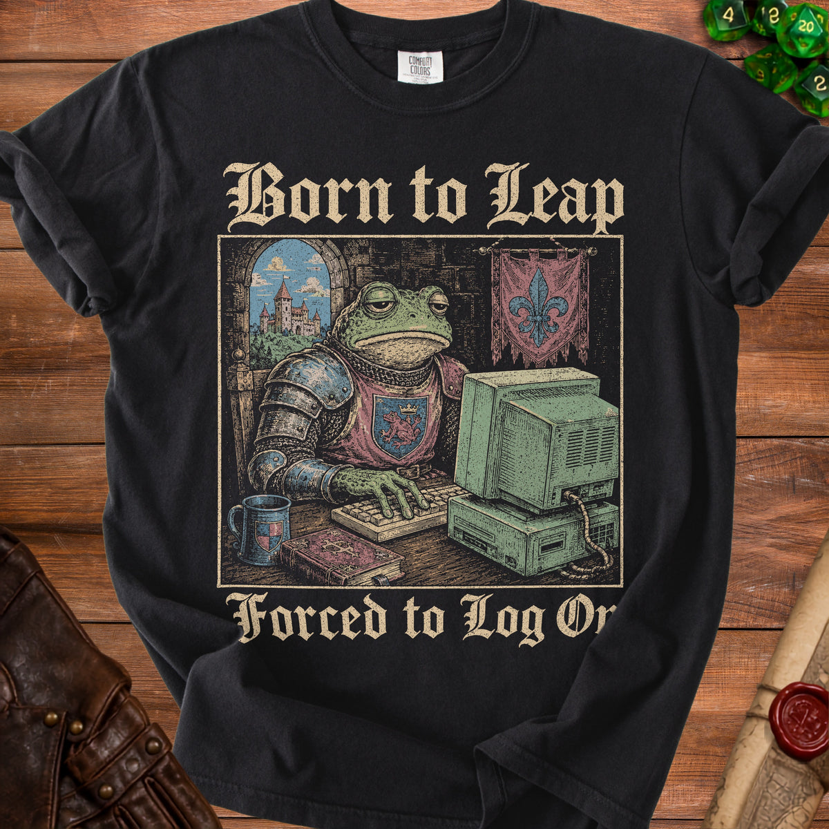 Black t-shirt with "Born to Leap Forced to Log Or" text and knight toad at computer graphic.