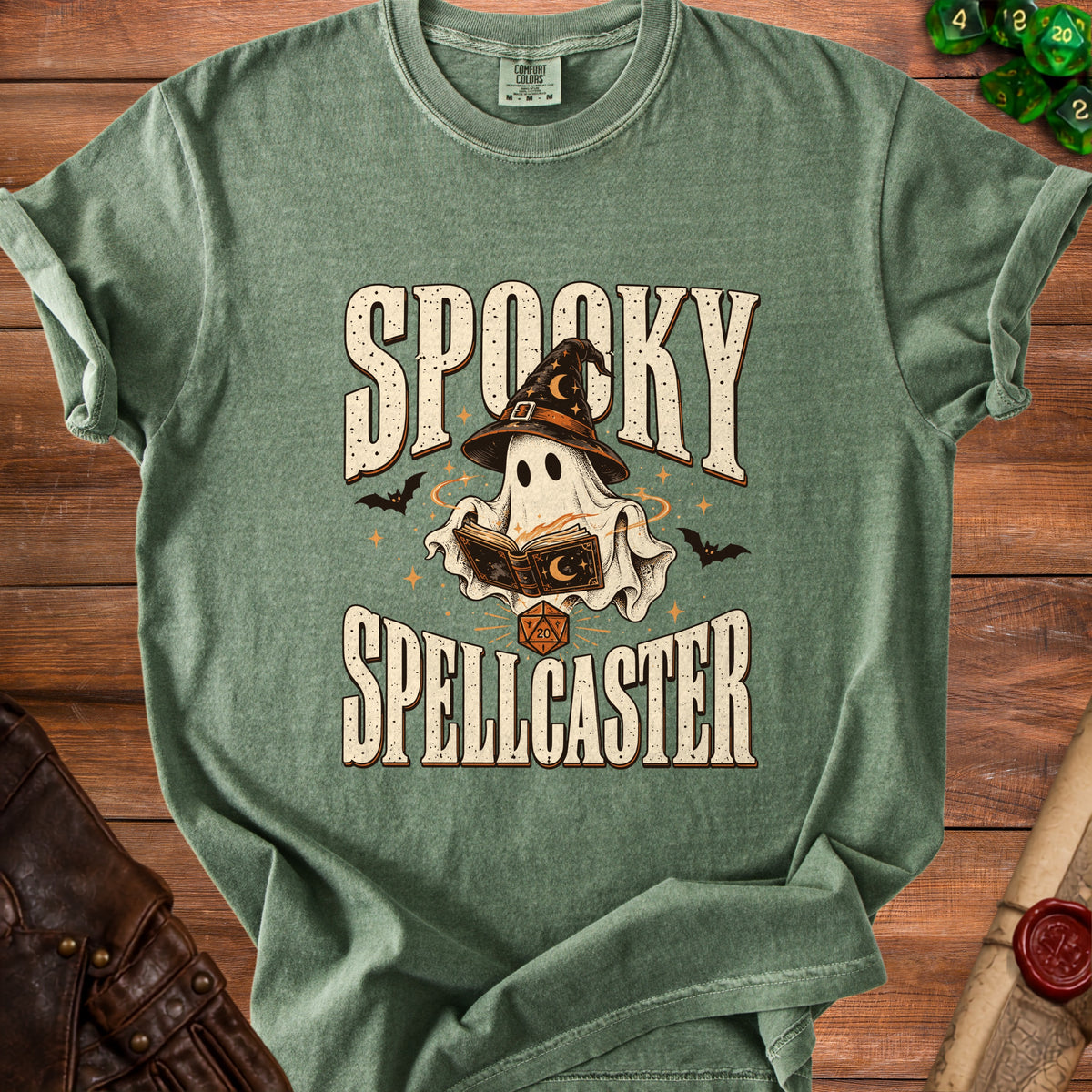 Green t-shirt with "Spooky Spellcaster" text, ghost in witch hat, and dice.