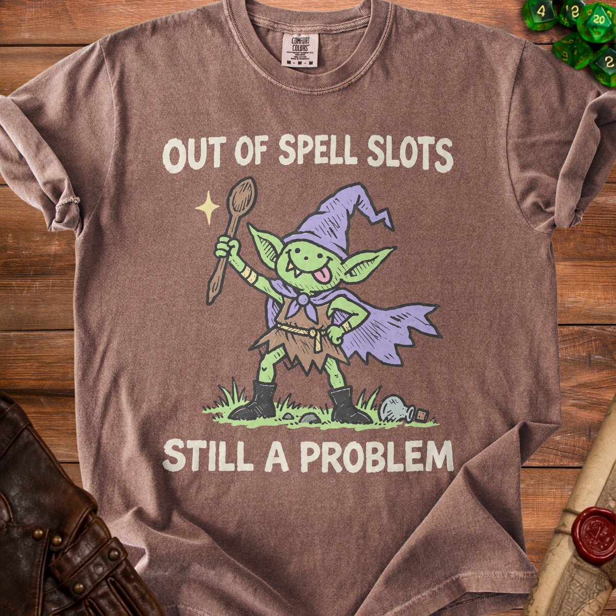 Brown t-shirt with goblin graphic and text "OUT OF SPELL SLOTS STILL A PROBLEM".