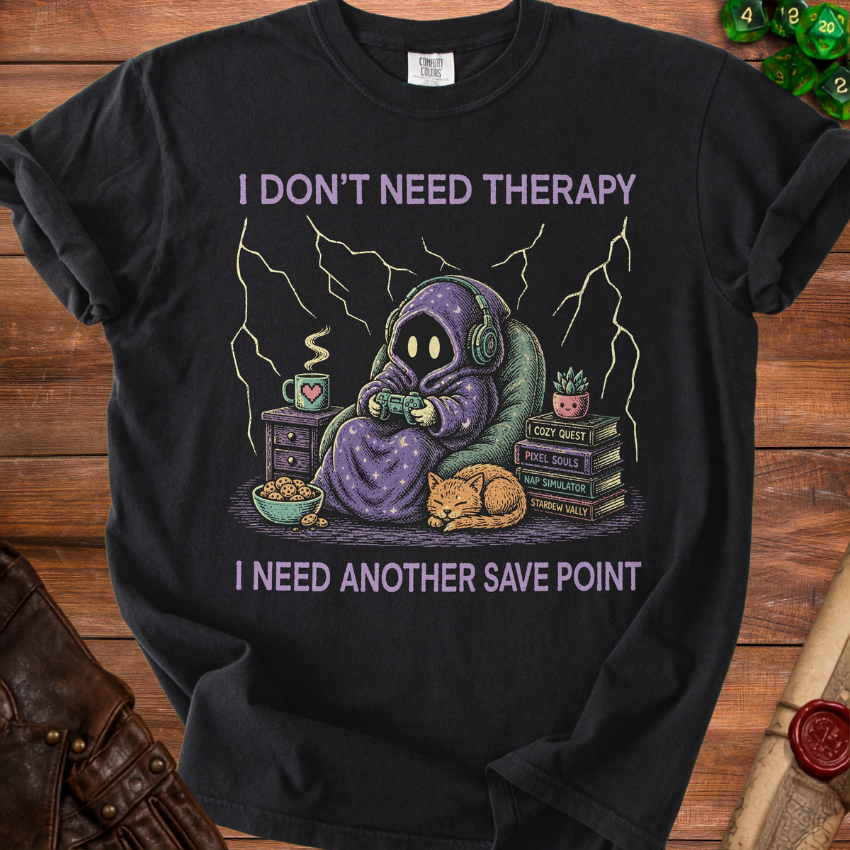 Black t-shirt with "I don't need therapy I need another save point" text and gamer graphics.