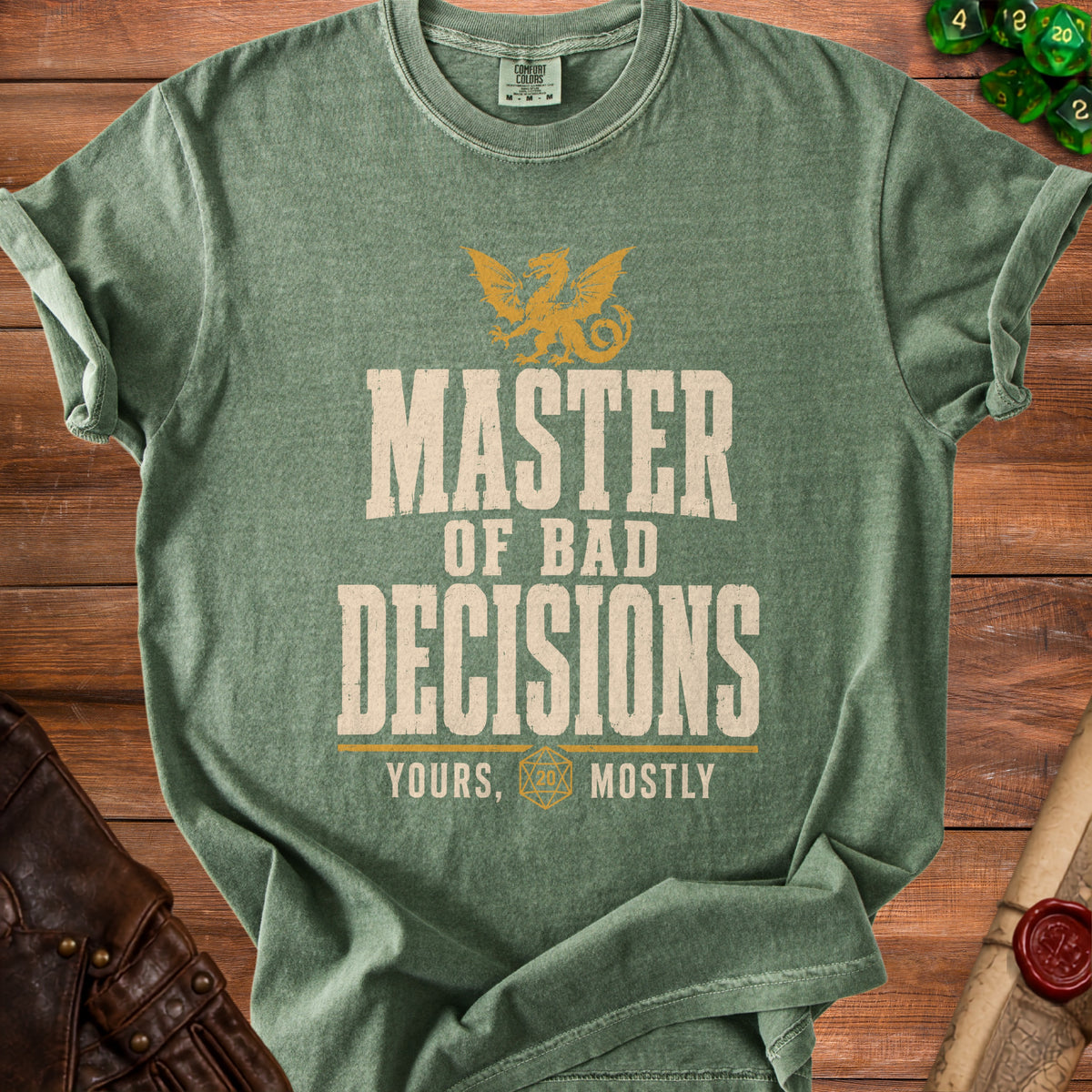 Green t-shirt with a dragon graphic and text "MASTER OF BAD DECISIONS YOURS, MOSTLY".