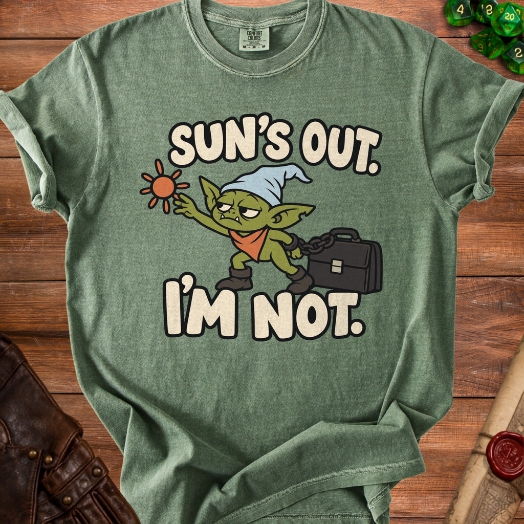 Green t-shirt with cartoon goblin and text "Sun's Out. I'm Not."
