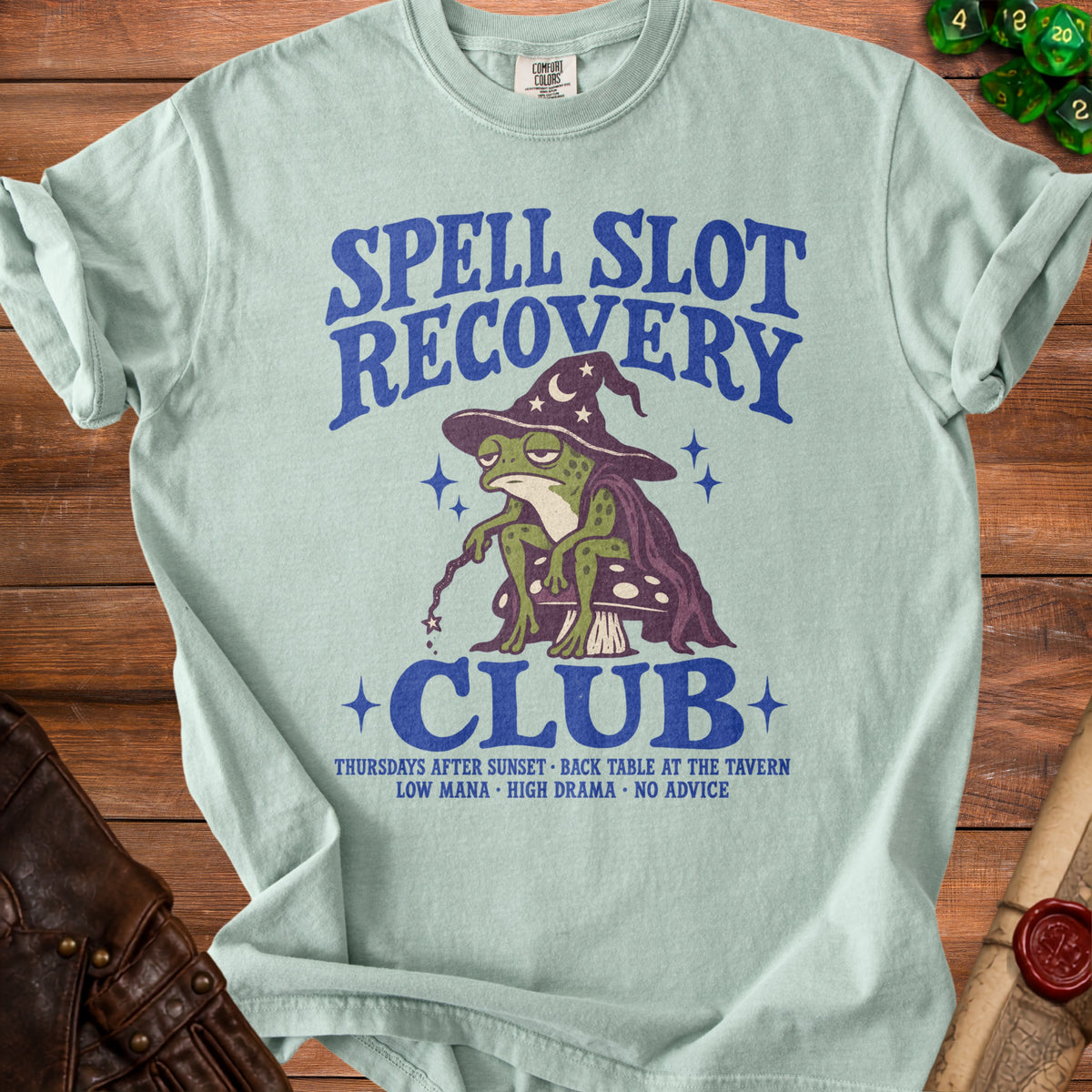 Light blue t-shirt with frog wizard graphic and "Spell Slot Recovery Club" text.