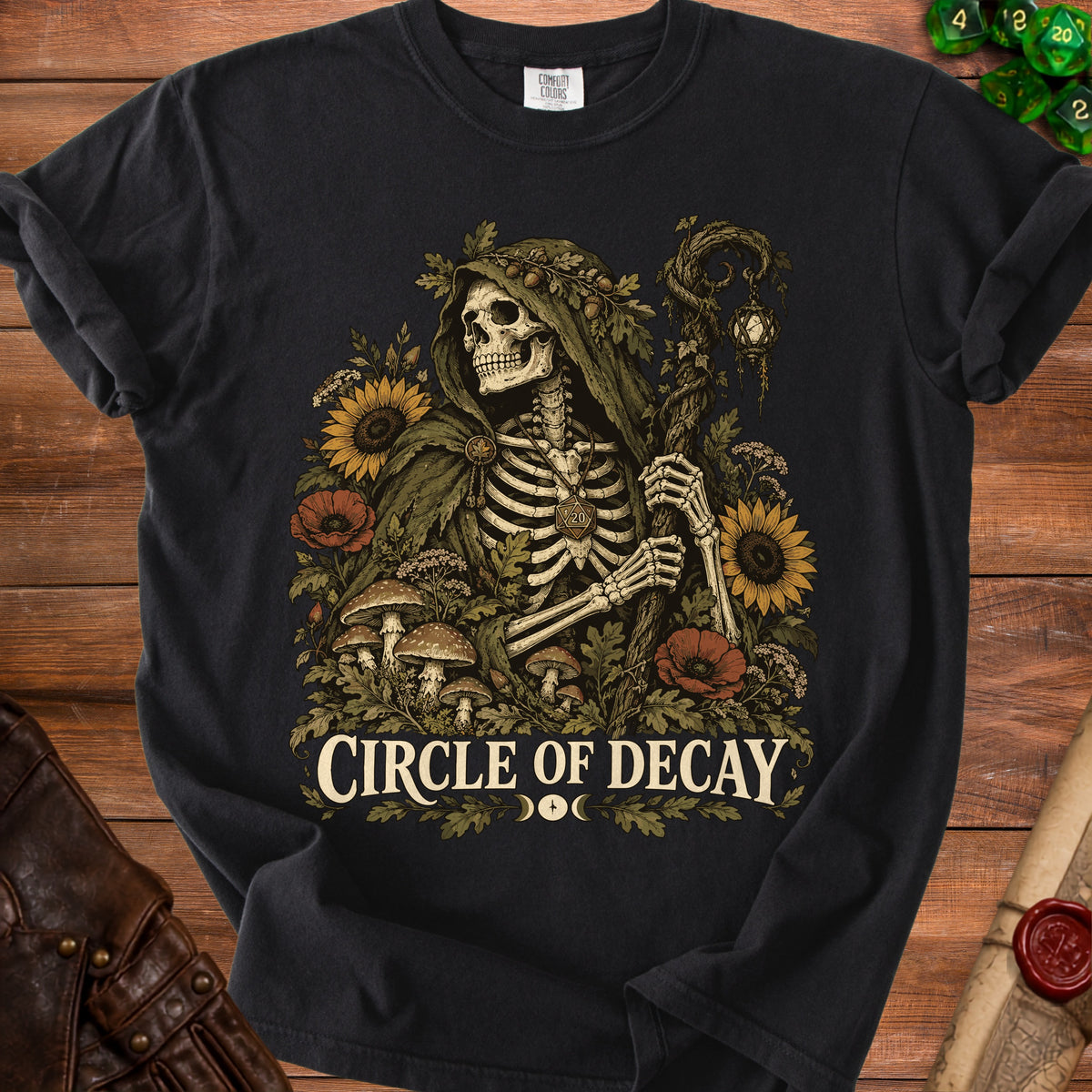 Skeleton in a green hooded cloak surrounded by flowers and text "CIRCLE OF DECAY".