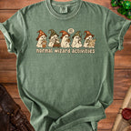 Green t-shirt with cartoon ghosts in wizard hats performing normal wizard activities.