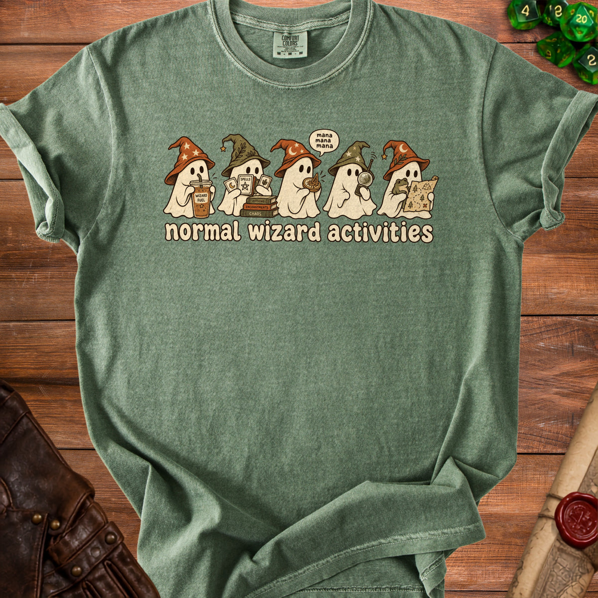 Green t-shirt with cartoon ghosts in wizard hats performing normal wizard activities.