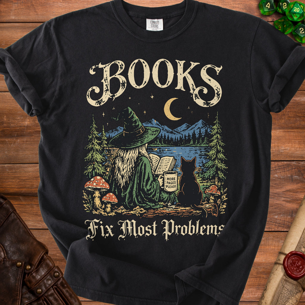 Black t-shirt with "BOOKS Fix Most Problems" and a witch reading with a cat.