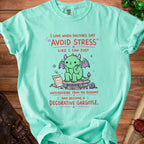 Mint green t-shirt with cartoon dragon and text: "Avoid stress... become a decorative gargoyle."