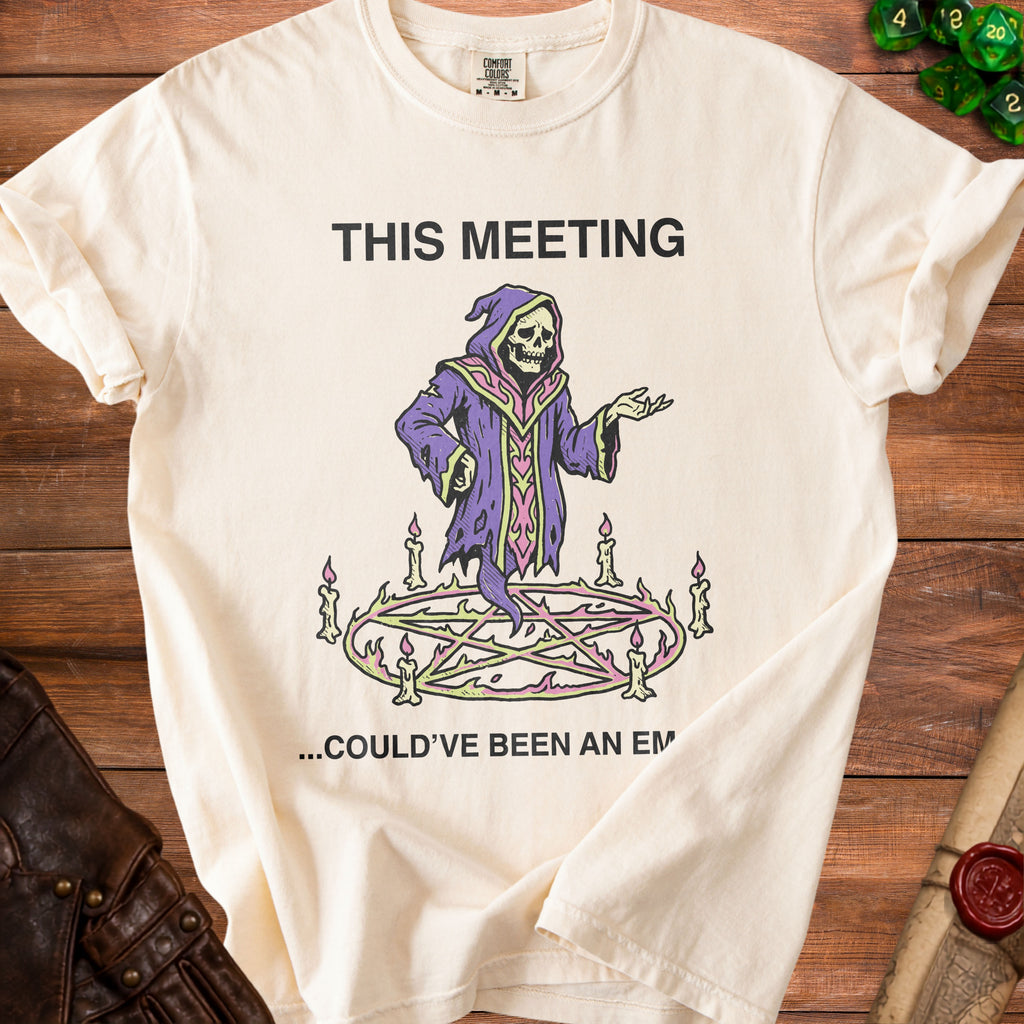 Cream t-shirt with "THIS MEETING ...COULD'VE BEEN AN EM" and grim reaper graphic.