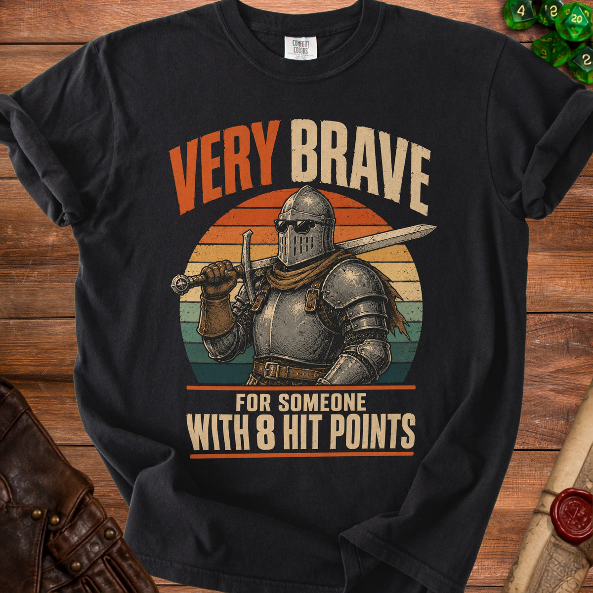 Black t-shirt with knight graphic and text "VERY BRAVE FOR SOMEONE WITH 8 HIT POINTS".