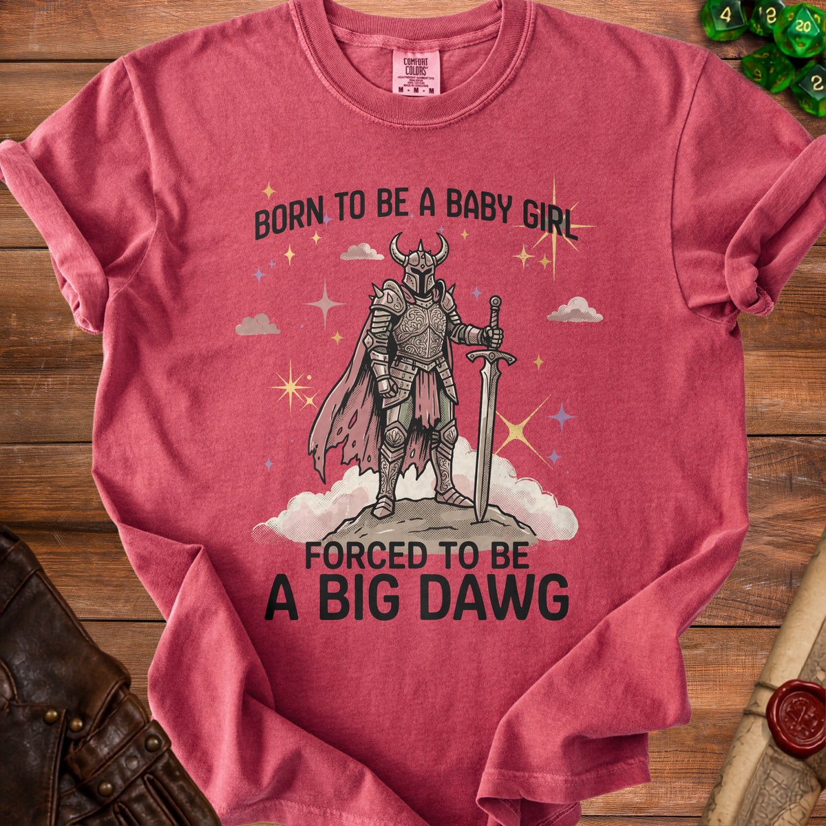 Red shirt with knight graphic and text "Born to be a baby girl, forced to be a big dawg".