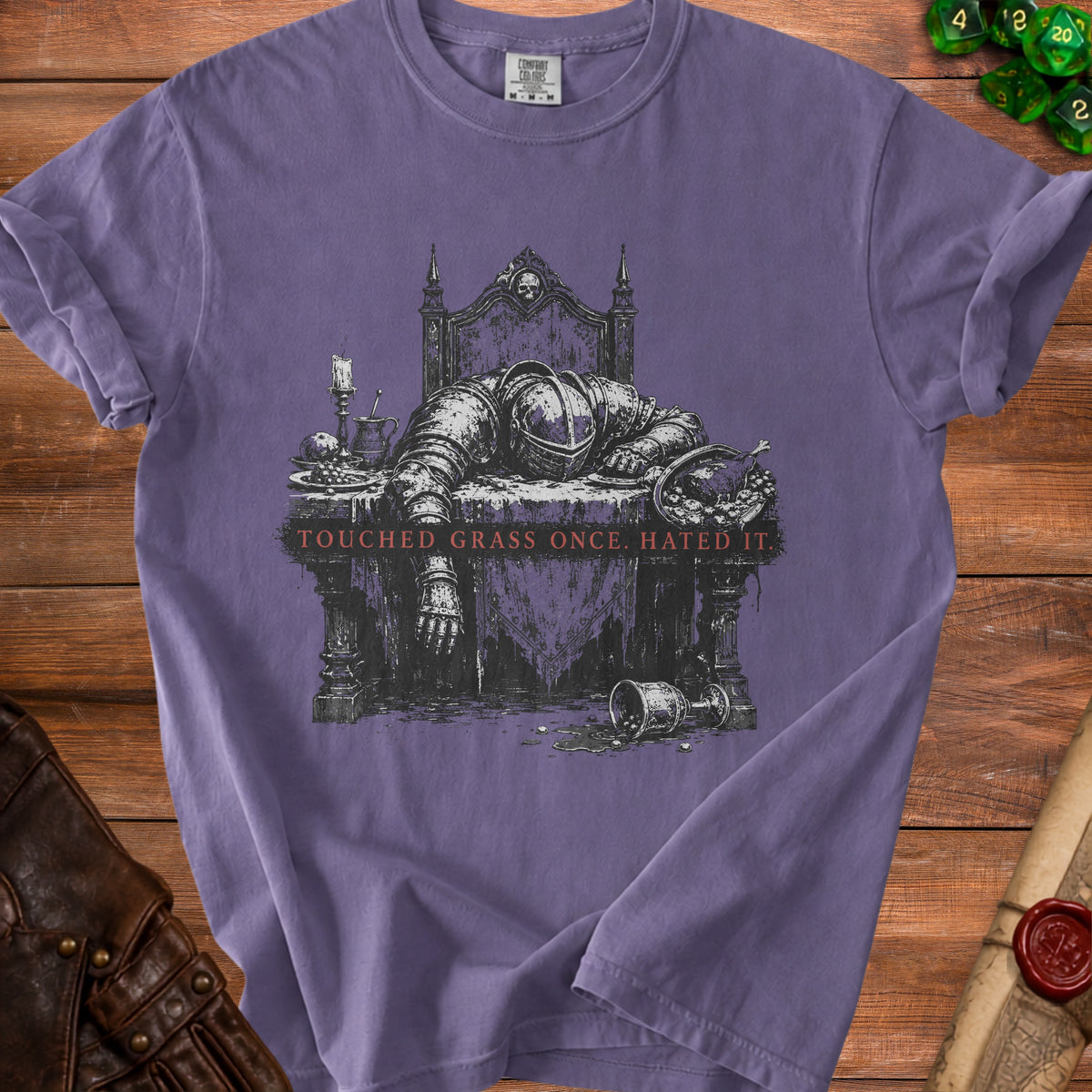 Purple t-shirt with distressed knight graphic and text "Touched grass once hated it."