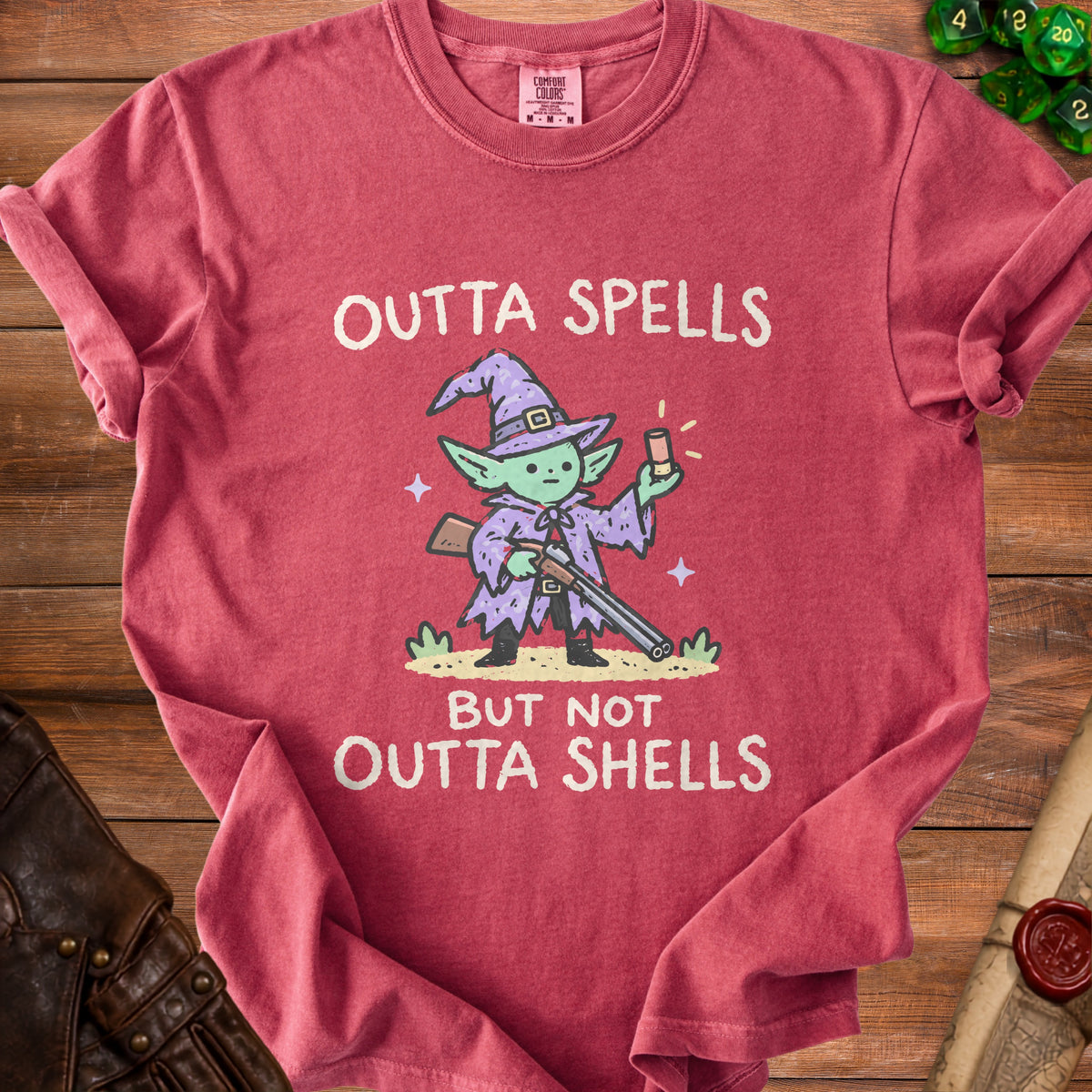 Red t-shirt with a goblin wizard and text "OUTTA SPELLS BUT NOT OUTTA SHELLS".